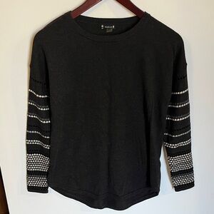 Small gray Smartwool shirt with polka dot sleeves